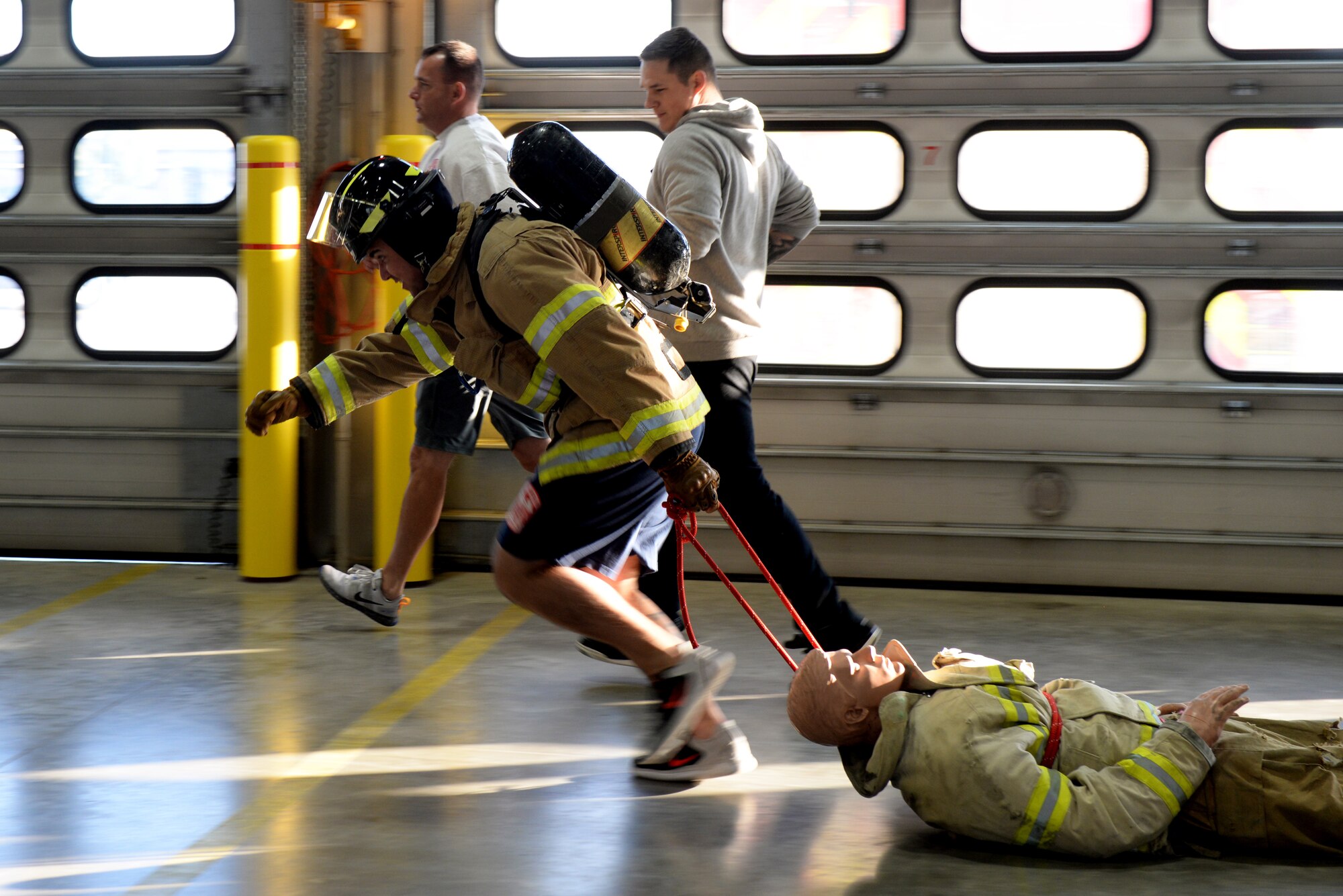 An Airman drags a dummy at the 28th Civil Engineer Squadron Fire Department at Ellsworth Air Force Base, S.D., Oct. 4, 2019. The physical exercises Airmen did during the Firefighter Challenge simulate what firefighters do during technical training in preparation for their operational duties at their installations. (U.S. Air Force photo by Airman Quentin K. Marx)