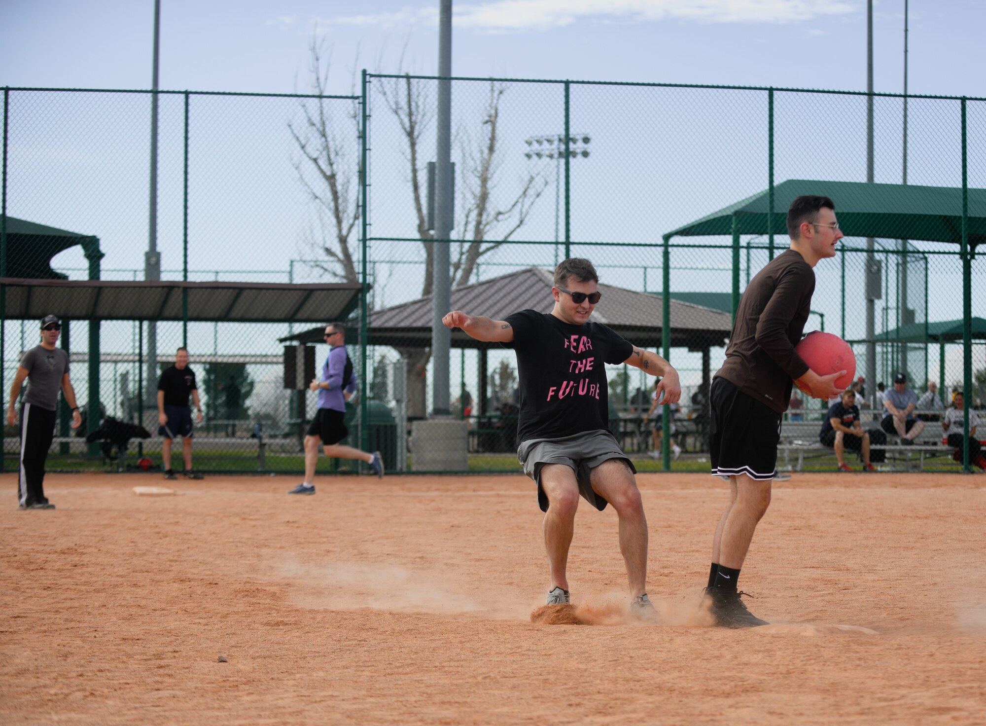 Staff Sgt. Reed Erickson, 460th Comptroller Squadron financial operations supervisor, slides into second base at the softball fields on Buckley Air Force Base, Colo.