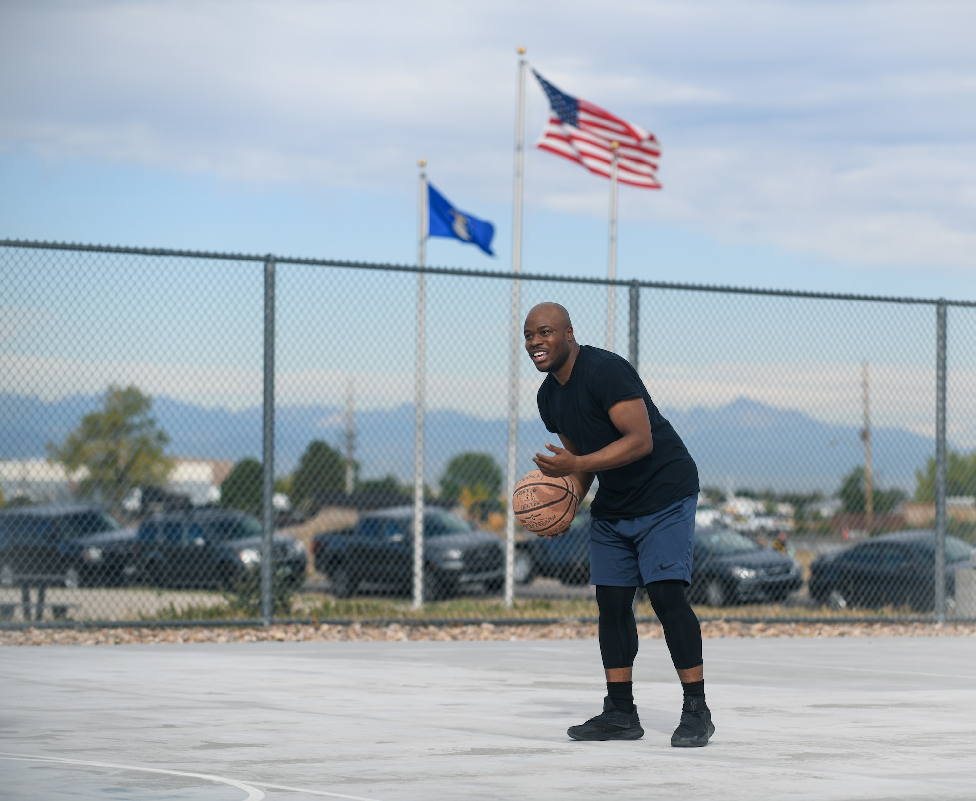 Senior Airman Nicholas Touriac Jr., a 460th Civil Engineer Squadron electrical power production technician, prepares to shoot a basketball at Panther Dorm basketball court on Buckley Air Force Base, Colo.
