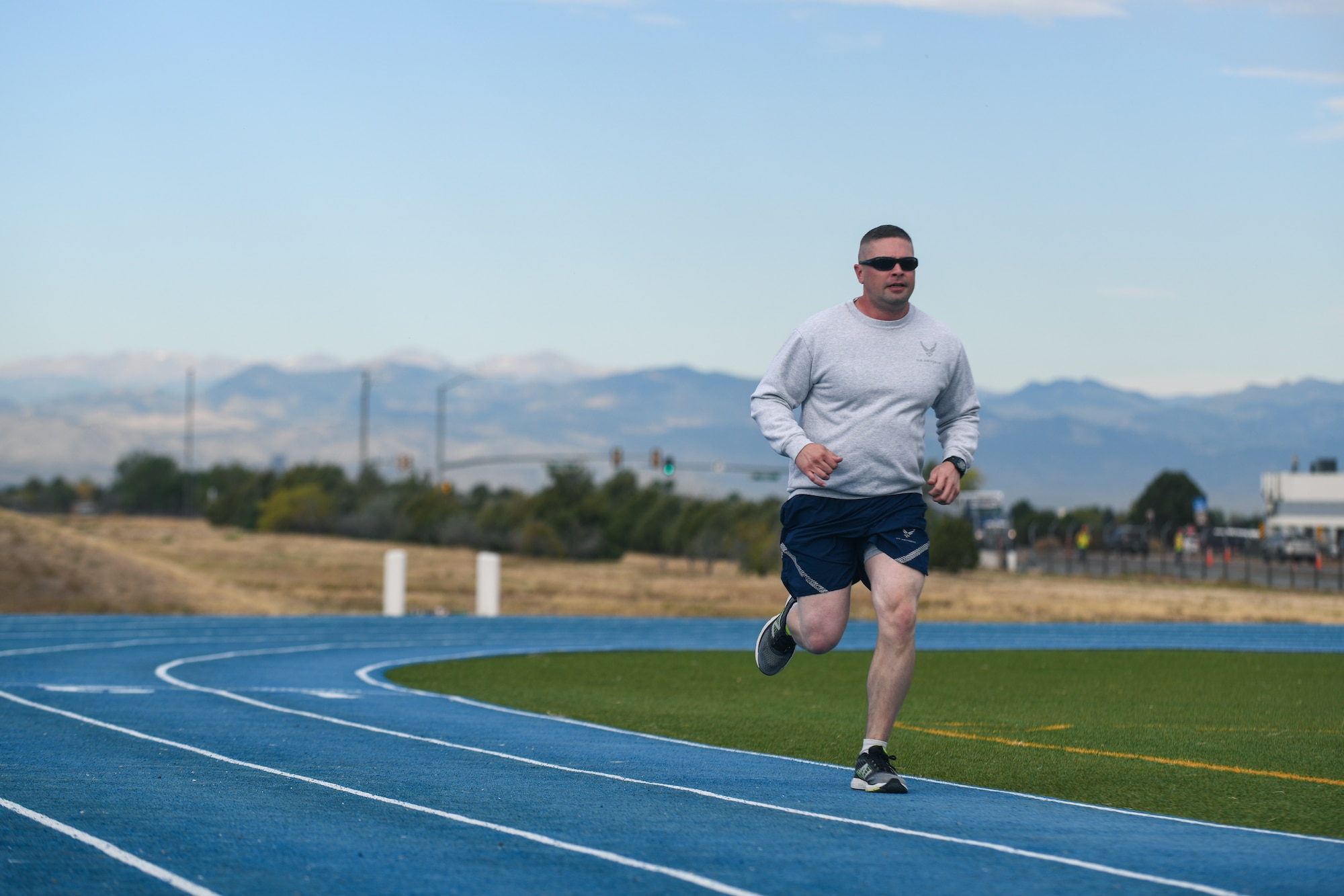 Senior Master Sgt. Kevin Ryan Jr., 11th Space Warning Squadron superintendent, runs his last lap of the one mile run at the track on Buckley Air Force Base, Colo.