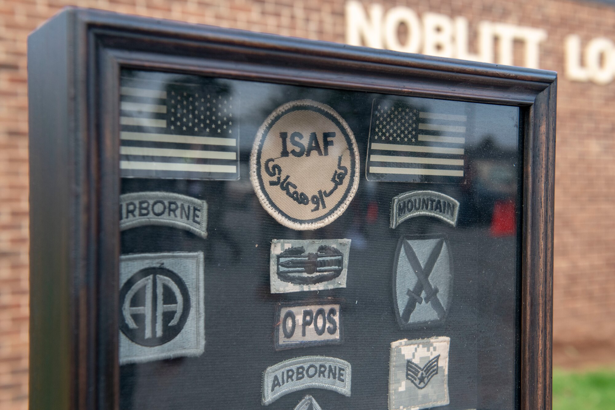 A Heritage Rock is displayed in front of the 97th Logistics Readiness Squadron.