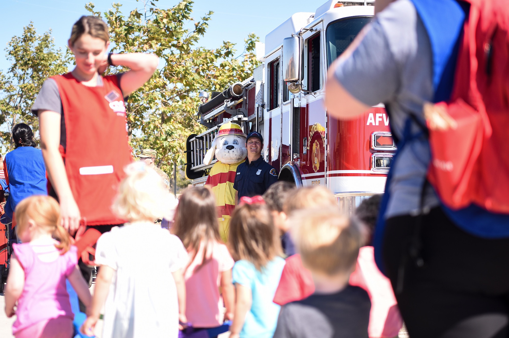 Sparky the fire dog greets children during Fire Prevention Week Oct. 7, 2019, at Vandenberg Air Force Base, Calif. Sparky, the mascot of the National Fire Protection Association, was created March 18, 1951, to convey important fire safety messages to children and adults. (U.S. Air Force photo by Airman 1st Class Hanah Abercrombie)