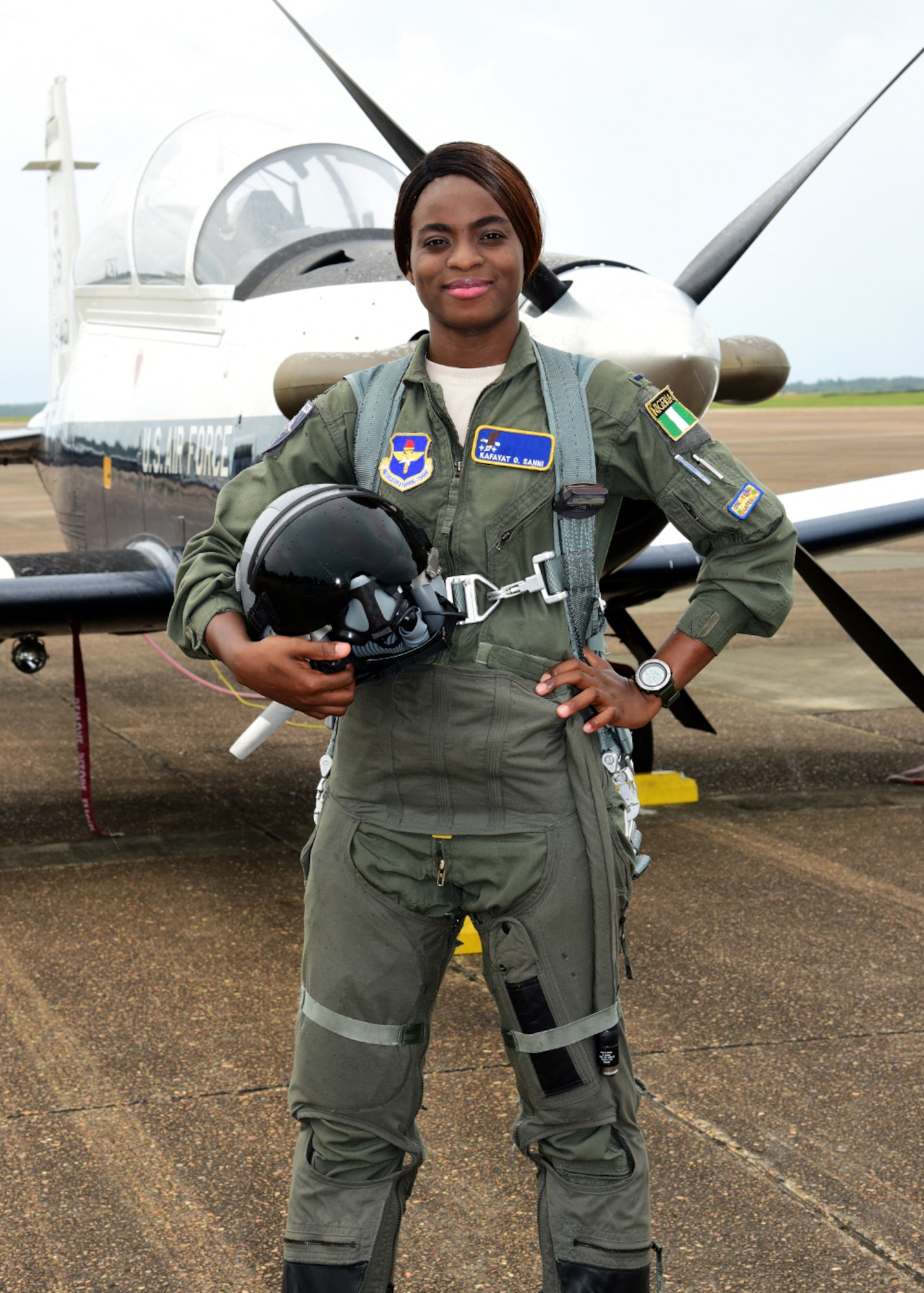 First Lt. Kafayat Sanni stands in front of a T-6 Texan II on Columbus Air Force Base, Miss. Sanni became the first female fighter pilot from the Nigerian air force, to graduate from the Aviation Leadership Program. ALP is a U.S. Air Force-funded program, providing students of friendly and developing countries with undergraduate pilot training scholarships. (Courtesy photo)