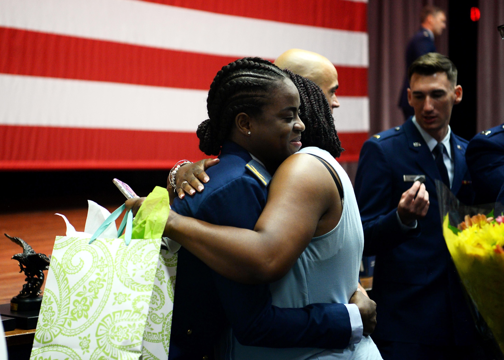 Col. Samantha Weeks, 14th Flying Training Wing commander, pins on 1st Lt. Kafayat Sanni’s silver wings during a graduation ceremony Aug. 16, 2019, on Columbus Air Force Base, Miss. Sanni became the first female fighter pilot in the Nigerian air force upon graduating from the Aviation Leadership Program. (U.S. Air Force photo by Airman Davis Donaldson)