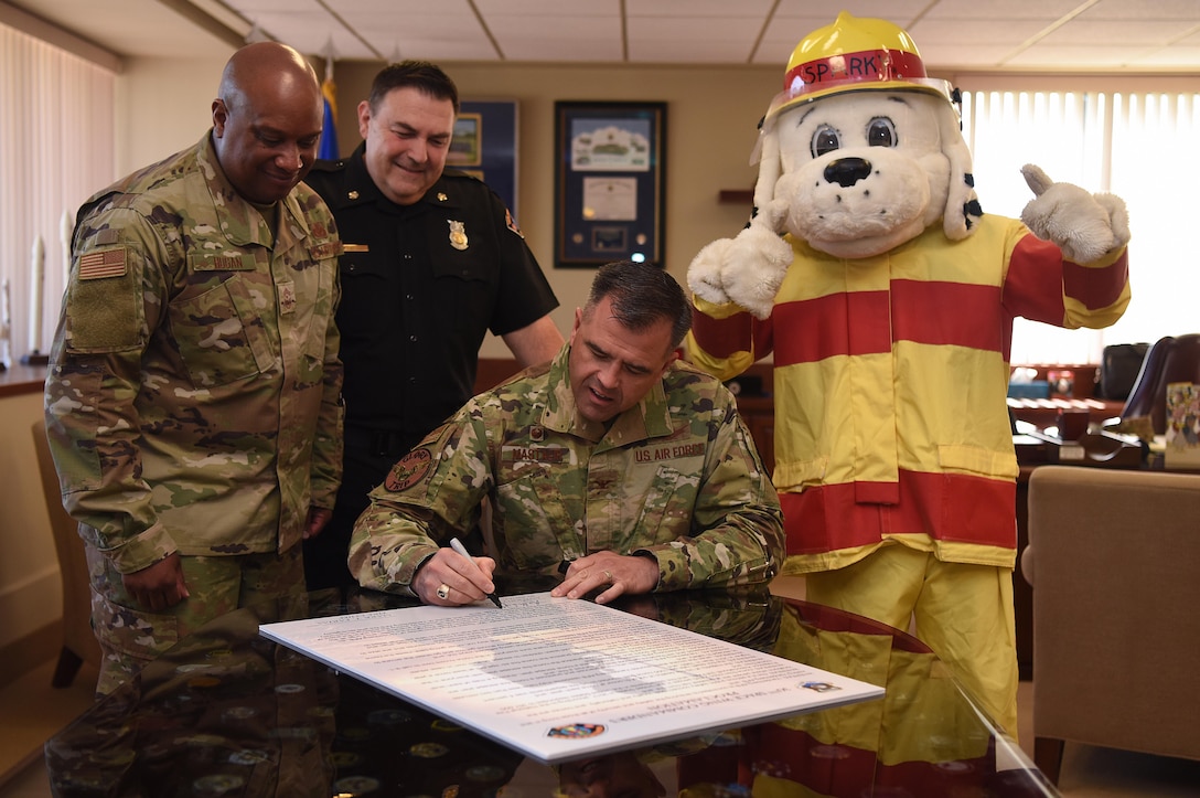 Col. Anthony Mastalir, 30th Space Wing commander, signs the Fire Prevention 30th Space Wing Commanders Proclamation Oct. 7, 2019, at Vandenberg Air Force Base, Calif. The proclamation is signed annually as a start to Fire Prevention Week and the first presidential proclamation for this week was made in 1925. (U.S. Air Force photo by Airman 1st Class Hanah Abercrombie)