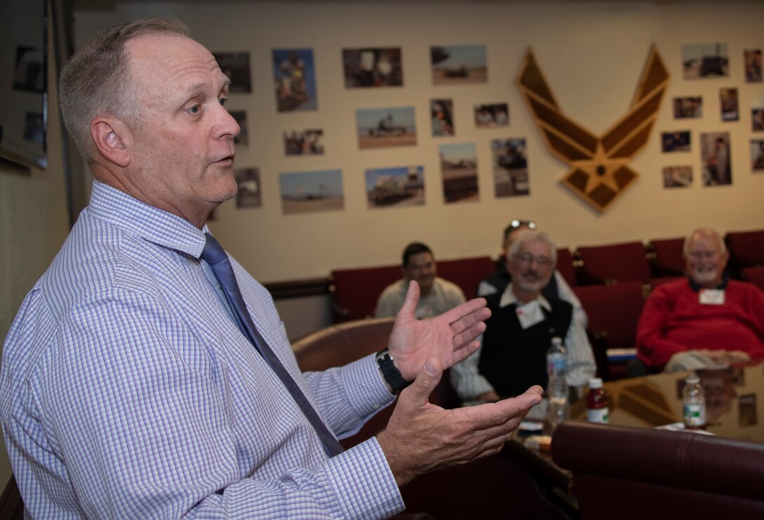 Dale Patterson, 60th Maintenance Group deputy director, delivers remarks during an introductory mission briefing for Travis AFB Honorary Commanders, Oct. 4, 2019, at Travis Air Force Base, California. The purpose of the Honorary Commanders Program is to promote relationships between base senior leadership and civilian partners, foster civic appreciation of the Air Force mission and its Airmen, maximize opportunities to share the Air Force story with new stewards and to communicate mutual interest, challenges and concerns senior leaders and civilian stakeholders have in common. (U.S. Air Force photo by Heide Couch)