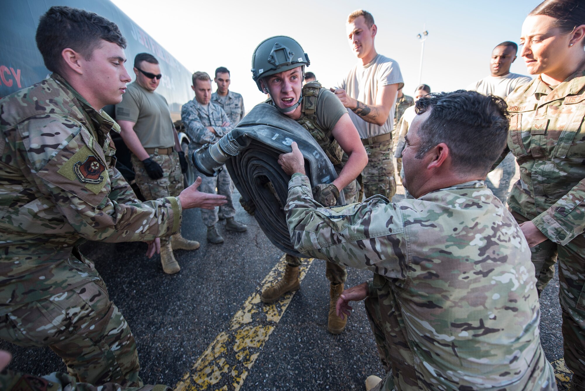 Airman 1st Class Caleb McDonald, 27th Special Operations Logistics Readiness Squadron fuels operator, lifts a fuel hose at the Forward Air Refueling Point tryouts at Cannon Air Force Base, N.M., October 9, 2019. During the tryouts, members do a physical test first and then are interviewed by the current FARP team. (U.S. Air Force photo by Senior Airman Vernon R. Walter III)