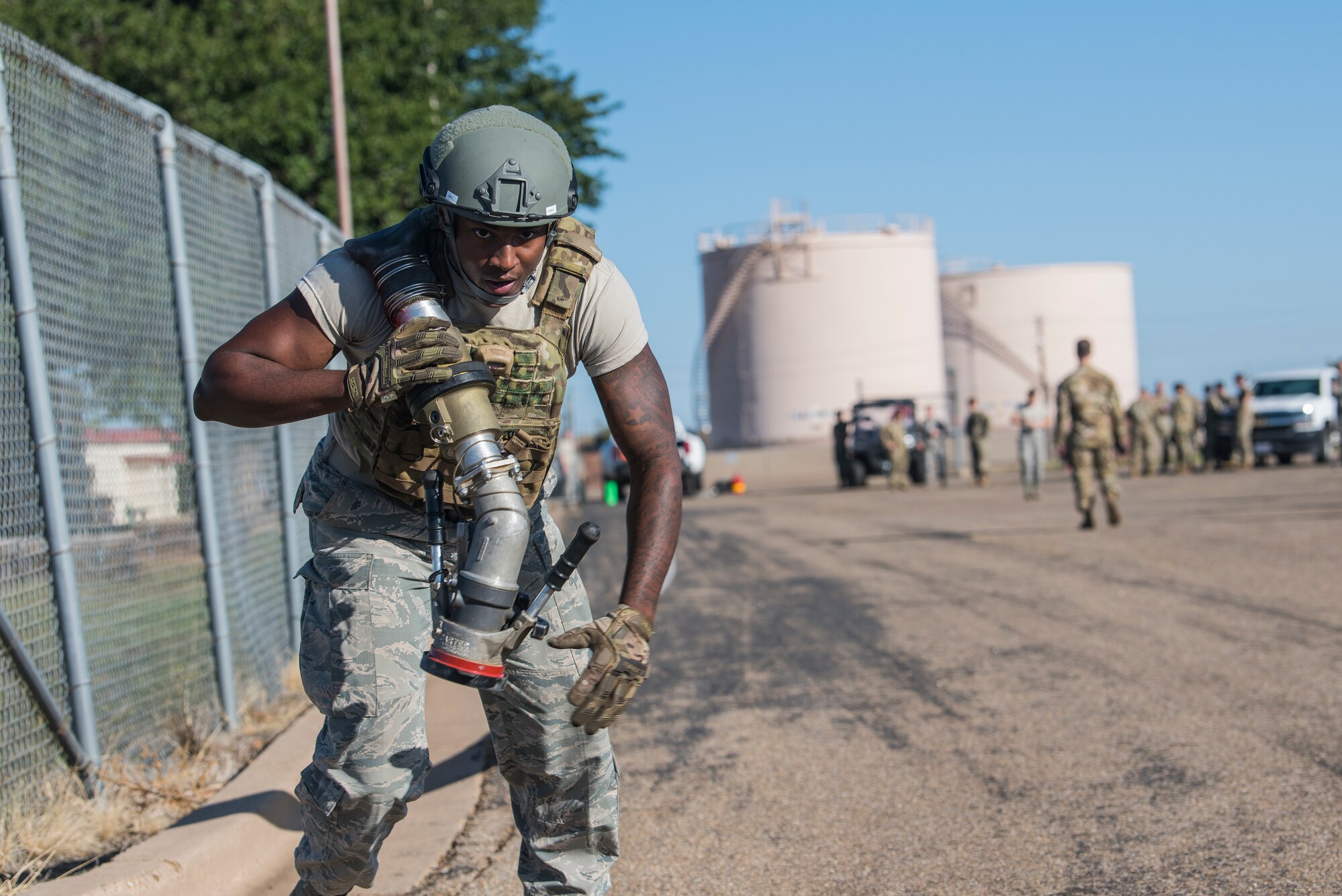 Senior Airman Demar Johnson, 27th Special Operations Logistics Readiness Squadron fuels service journeyman, drags a 300 foot fuel hose during the Forward Air Refueling Point tryouts at Cannon Air Force Base, N.M., October 9, 2019. The FARP team is composed of nine members and are currently aiming to grow to a unit of 12. (U.S. Air Force photo by Senior Airman Vernon R. Walter III)