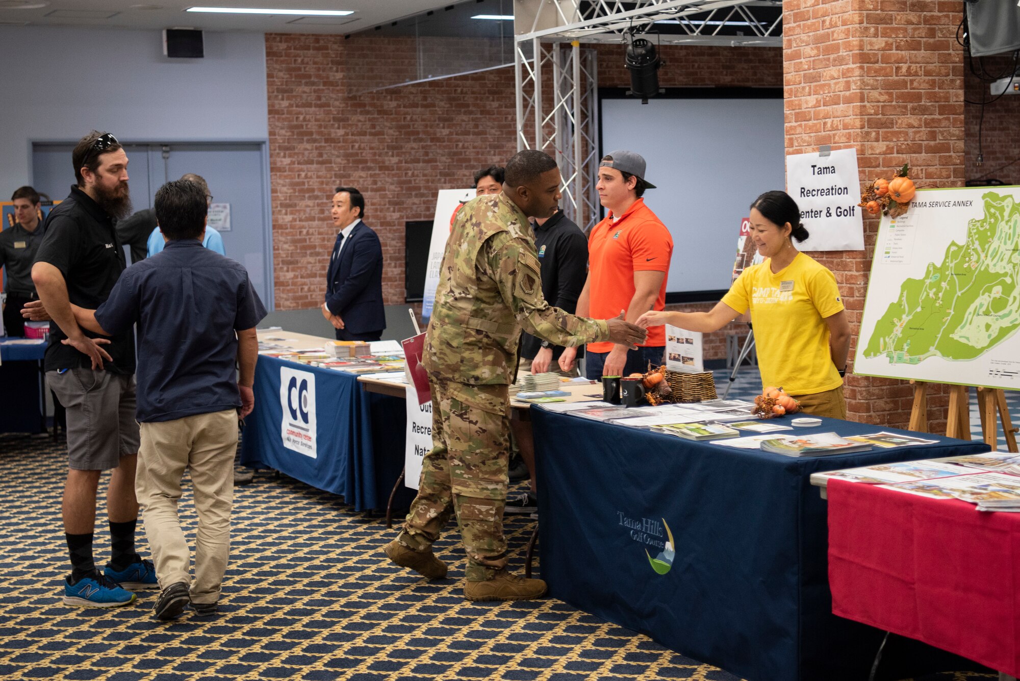 Col. Otis C. Jones, 374th Airlift Wing commander, greets volunteers at the information fair on Oct. 2, 2019, at Yokota Air Base, Japan.