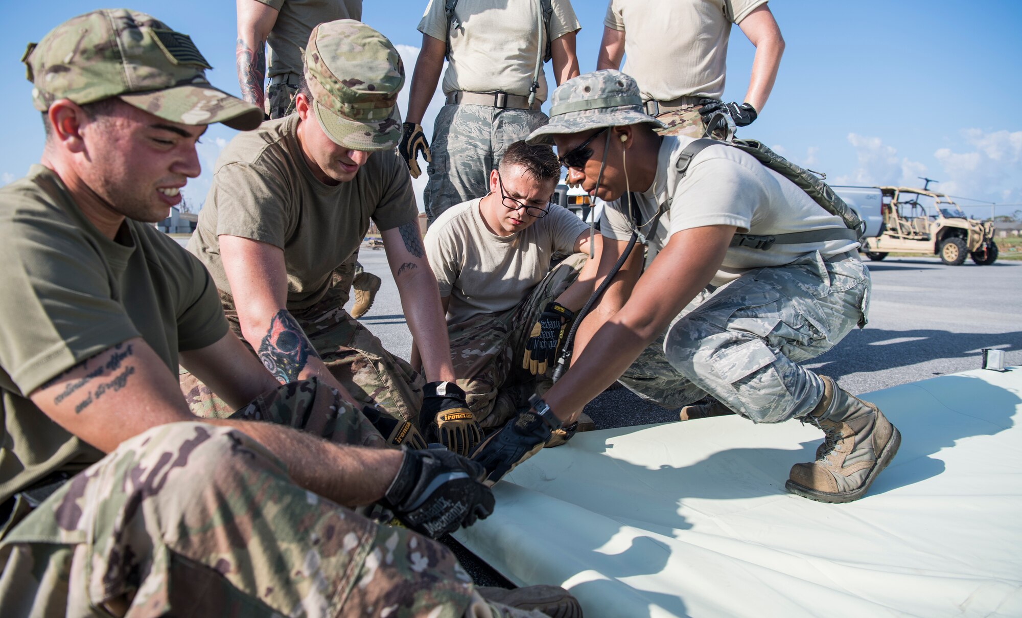 Airmen from the 823rd Civil Engineer Squadron (REDHORSE), from Hurlburt Field, Fla., construct bare-bones shelters as part of a multiphased plan to rebuild Tyndall Air Force Base, Fla.