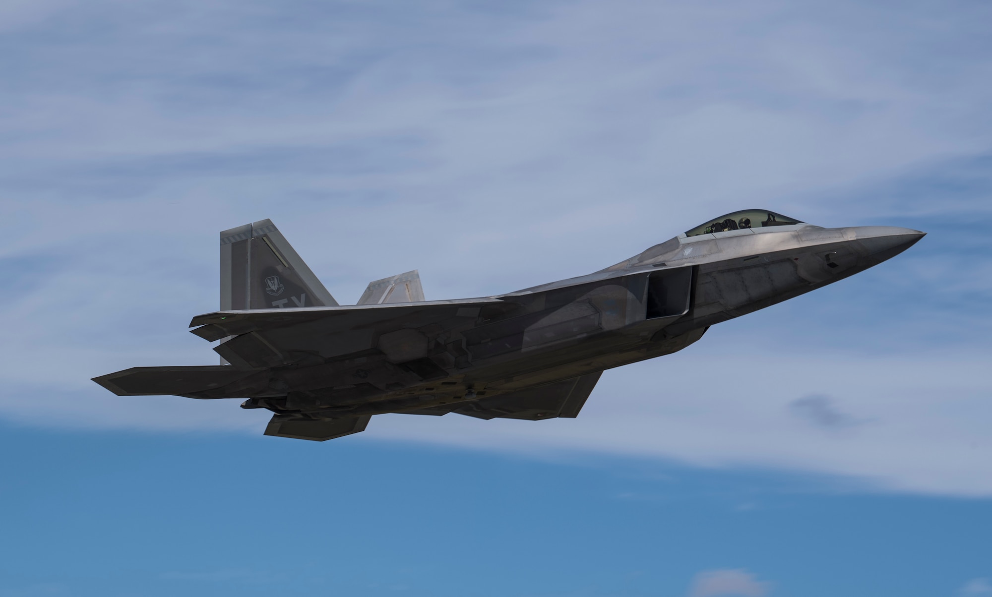 A Pilot from the 27th Fighter Wing, Joint Base Langly-Eustis, Virginia, flies an F-22 Raptor out of  Tyndall Air Force Base, Florida, Oct. 21, 2018, following the aftermath of Hurricane Michael. Multiple major commands have mobilized relief assets in an effort to restore operations after the hurricane caused catastrophic damage to the base. (U.S. Air Force photo by Senior Airman Keifer Bowes)