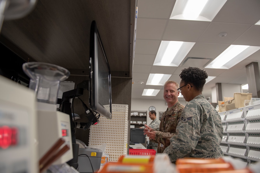 U.S. Air Force Col. Brian Laidlaw, 325th Fighter Wing commander, works alongside Airman 1st Class Kejalae Dicks, 325th Medical Group pharmacy technician, as part of the Airman Shadow program at the Tyndall pharmacy, April 4, 2019. Dicks is described by her leadership as a true go-getter who is always looking for ways to improve the mission. She plays a vital role in the supply and purchase of all medications in the pharmacy. (U.S. Air Force photo by Senior Airman Javier Alvarez)