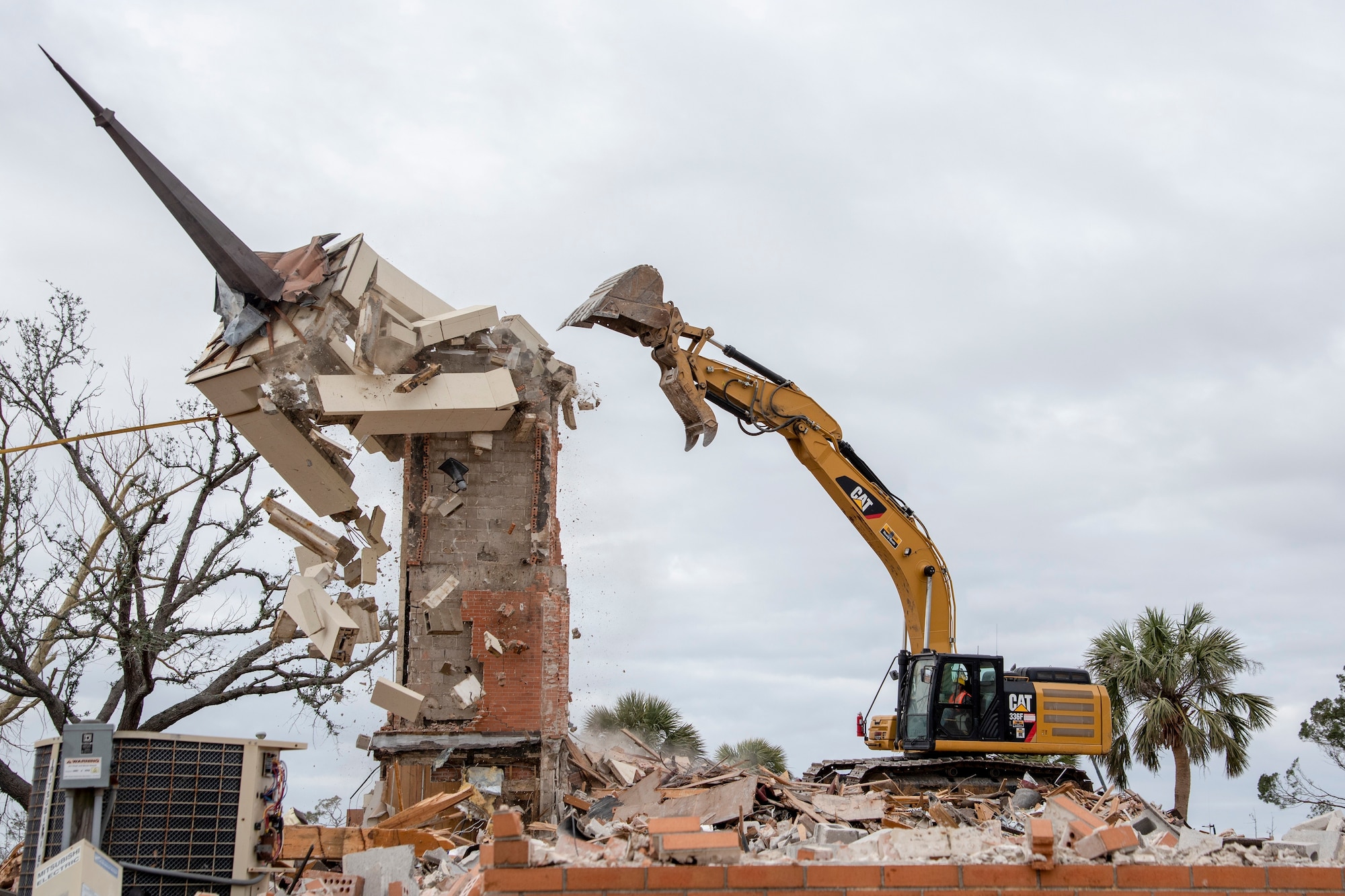 A construction crew demolishes the steeple at Chapel 2 at Tyndall Air Force Base, Fla. Feb. 15, 2019.