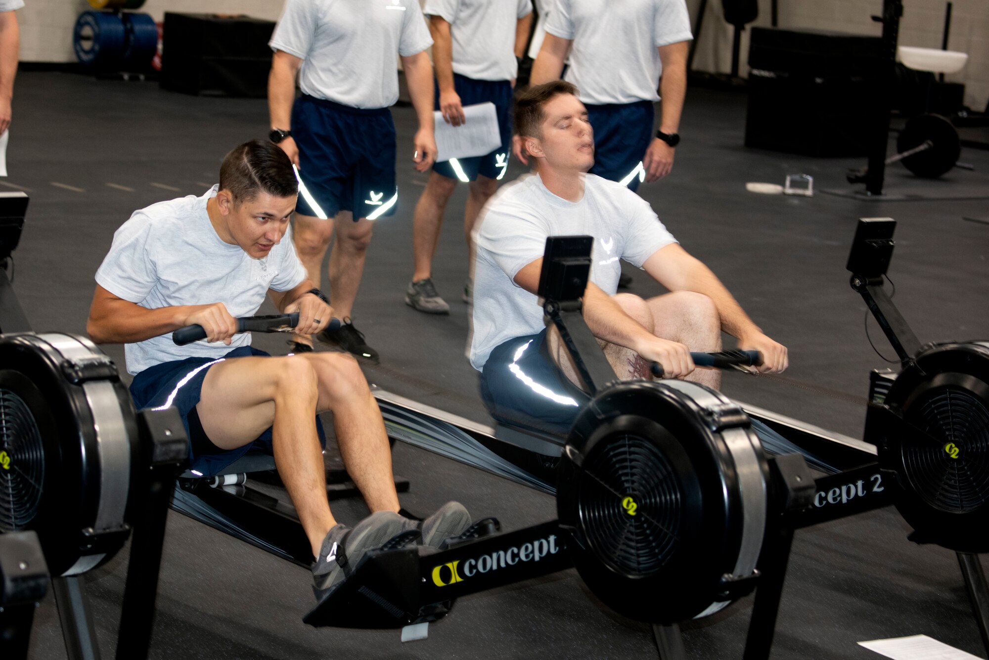 U.S. Air Force Tech. Sgt. Criss Draft, left, and Senior Airman Zachary Stringer, 20th Civil Engineer Squadron, Explosive Ordnance Disposal (EOD) flight technicians, row 1,000 meters during the beta test of the EOD Tier 2 practice fitness test at Shaw Air Force Base, South Carolina, Oct. 4, 2019.