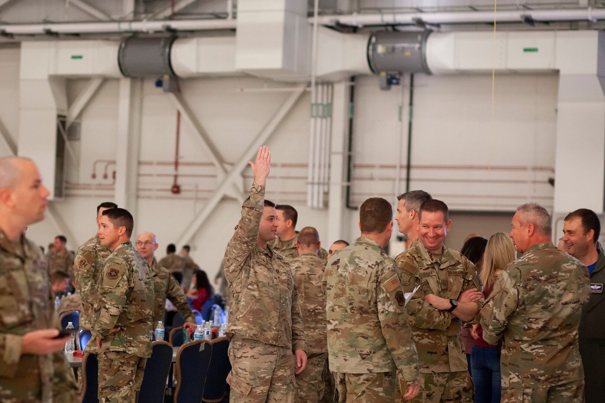 Maintainers from the 22nd Air Refueling Wing socialize during the Knucklebuster’s Award Ceremony Oct. 5, 2019, at McConnell Air Force Base, Kan. More than 600 Airmen from Team McConnell attended the event. (U.S. Air Force photo by 2nd Lt. Kaitlyn Danner)