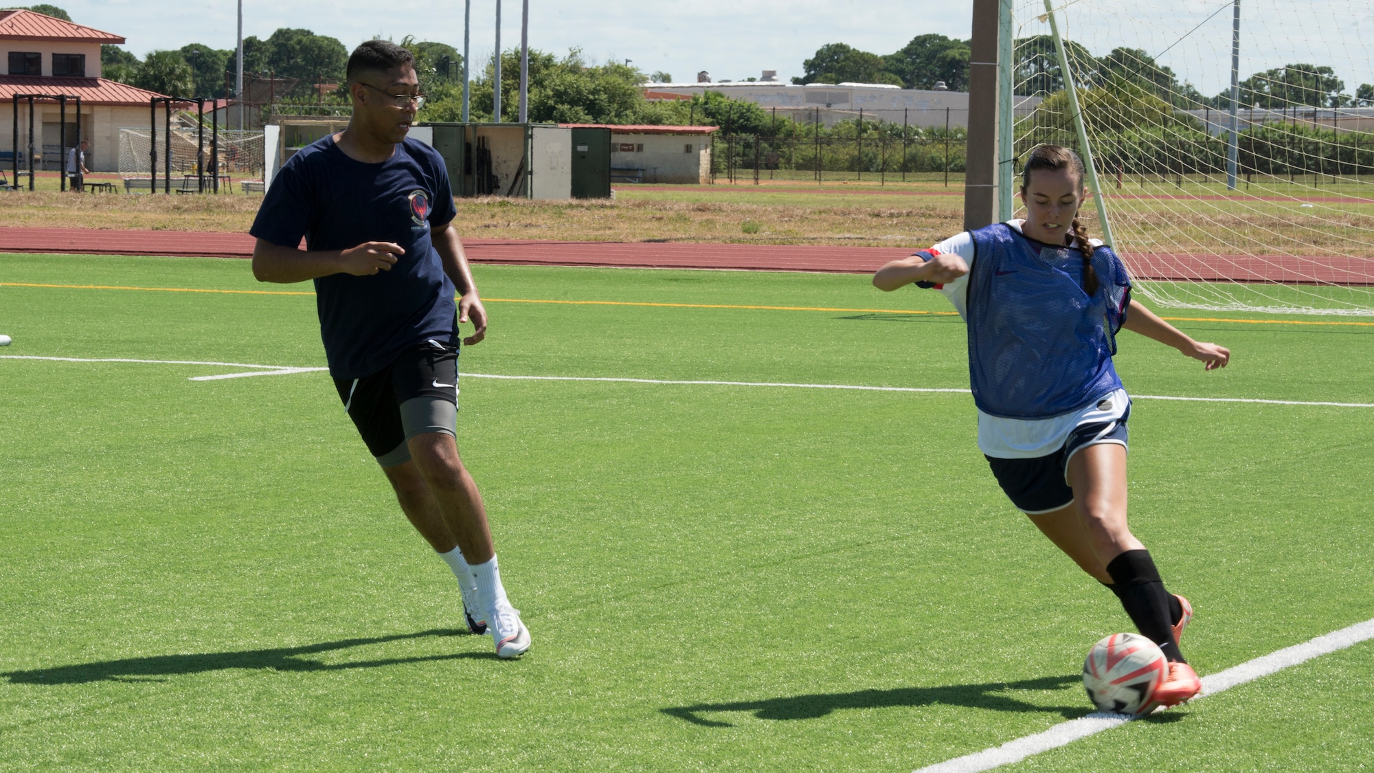 U.S. Air Force Airman 1st Class Alexia Cook, 6th Air Refueling Wing Command Post controller, dribbles past a defender, during a match at MacDill’s Hispanic Heritage Soccer Tournament, Oct. 4, 2019, at MacDill Air Force Base, Fla.  Hispanic Heritage Month is observed from Sept. 15 to Oct. 15 to celebrate the contributions of American citizens whose ancestors came from Spain, Mexico, the Caribbean and Central and South America. (U.S. Air Force photo by Airman 1st Class Shannon Bowman)