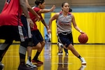 Air Force Staff Sgt. Cinnamon Kava dribbles past defenders during the U.S. armed forces women's basketball team's scrimmage at Fort Indiantown Gap, Pa., Oct. 3, 2019. The team held practices in preparation for the Military World Games scheduled to take place in China, Oct. 18-28.