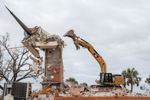 A construction crew demolishes the steeple at Chapel 2 at Tyndall Air Force Base, Fla. Feb. 15, 2019.