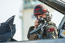U.S. Air Force Capt. Phillip McCoy, a 13th Fighter Squadron F-16 Fighting Falcon pilot, dons his face mask before flight during an aviation training relocation at Komatsu Air Base, Japan, Oct. 1, 2019. Pilots conducted within visual range air-to-air combat training with Japan Air Self- Defense Force pilots aiding in the increase of tactical strength, friendship and alliance. (U.S. Air Force photo by Senior Airman Collette Brooks)