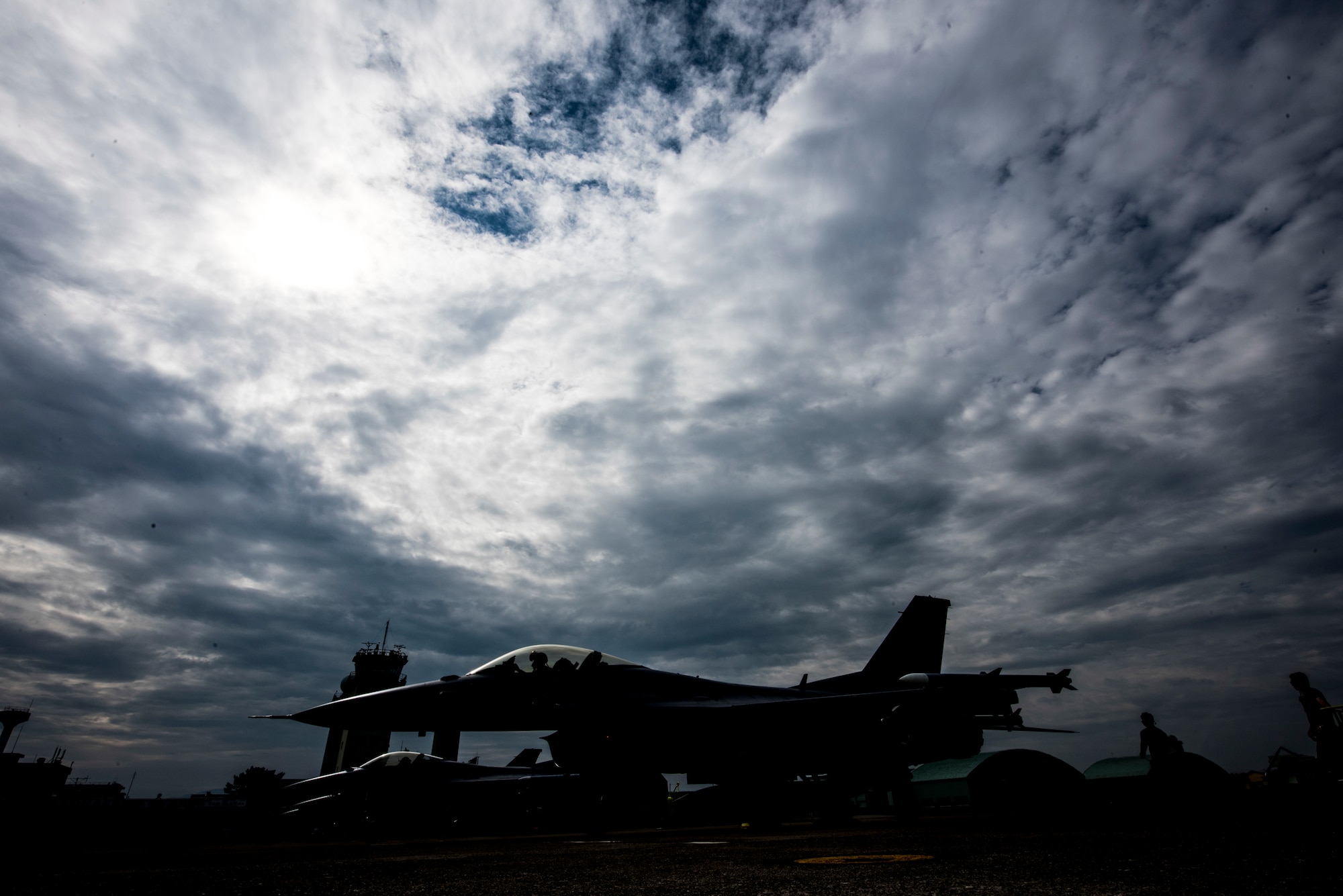 A U.S. Air Force F-16 Fighting Falcon sits on the Komatsu flight line during the 2019 Komatsu aviation training relocation at Komatsu Air Base, Japan, Oct. 2, 2019. The ATR gave 13th Fighter Squadron pilots an opportunity to work alongside their host nation counterparts, Japan Air Self-Defense Force, during the 28 within visual range air-to-air sorties. (U.S. Air Force photo by Senior Airman Collette Brooks)