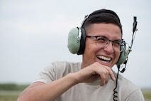 U.S. Air Force Senior Airman Gabriel Contreras, a 13th Aircraft Maintenance Unit crew chief, smiles during an aviation training relocation at Komatsu Air Base, Japan, Oct. 2, 2019. The ATR gave participants an opportunity to survey and experience the Komatsu airfield, while gaging their ability to operate in a simulated deployed location. (U.S. Air Force photo by Senior Airman Collette Brooks)