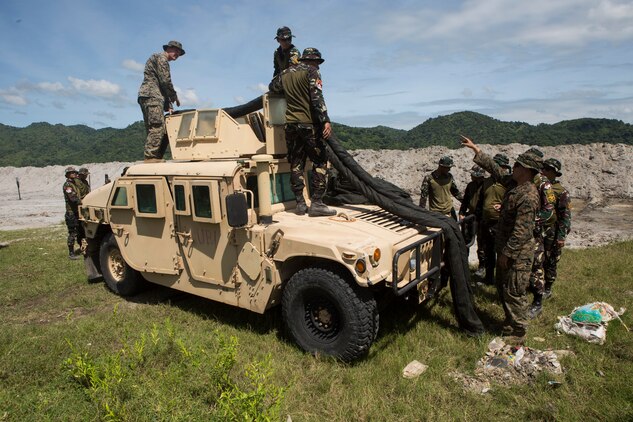 U.S. Marines and Philippine Airmen perform a practical application of setting up a team position during a subject matter expert exchange as part of exercise KAMANDAG 3 at Colonel Ernesto P. Ravina Air Base, Philippines, Oct. 9, 2019. KAMANDAG is a routine training exercise that advances military modernization and capability development through SMEEs. KAMANDAG 3 is a Philippine-led, bilateral exercise with participation from Japan. KAMANDAG is an acronym for the Filipino phrase “Kaagapay Ng Mga Manirigma Ng Dagat,” which translates to “Cooperation of the Warriors of the Sea,” highlighting the partnerships between the U.S. and Philippine militaries.