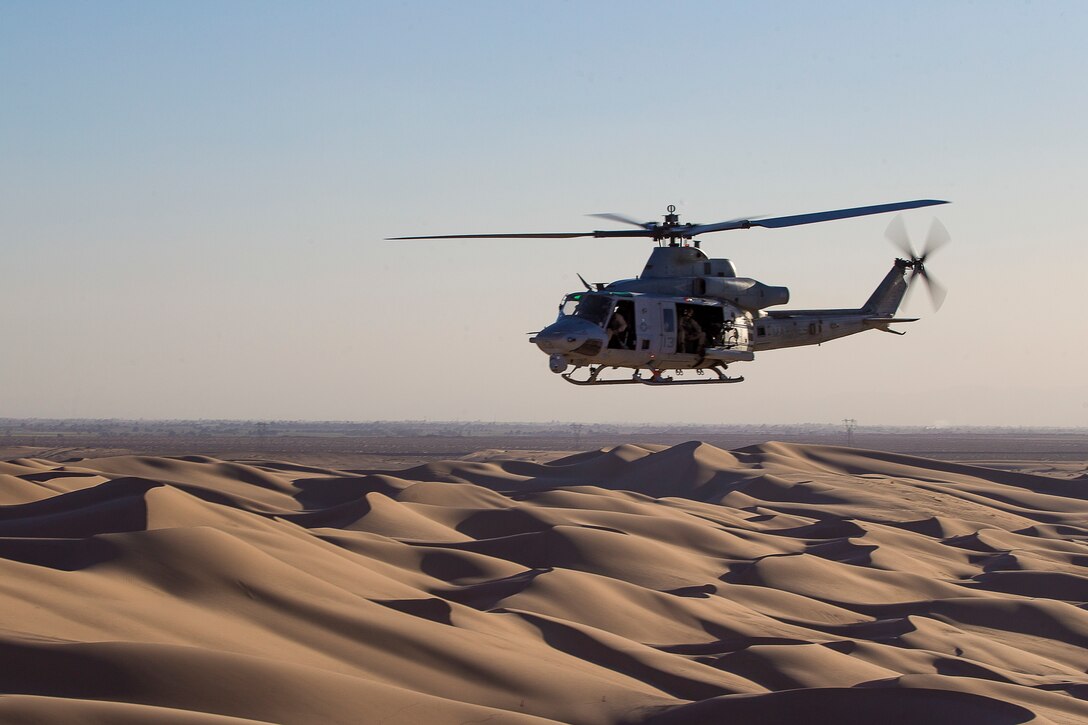 A U.S. Marine Corps UH-1Y Venom aircraft assigned to Marine Aviation Weapons and Tactics Squadron One conducts a simulated urban close air support exercise during Weapons and Tactics Instructor course 1-20 in Brawley, California, Oct. 3, 2019. WTI is a seven-week training event hosted by MAWTS-1, which emphasizes operational integration of the six functions of Marine Corps aviation in support of a Marine Air Ground Task Force. WTI also provides standardized advanced tactical training and certification of unit instructor qualifications to support Marine aviation training and readiness, and assists in developing and employing aviation weapons and tactics.