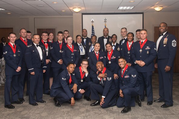 Col. Lee Gentile, 47th Flying Training Wing commander, and Chief Master Sgt. Robert Zackery III, 47th Flying Training Wing command chief, present Laughlin Air Force Base, Texas’ newest staff sergeants and master sergeants, Oct. 4, 2019. Laughlin inducted more than 20 new staff sergeants and six new master sergeants at last Friday’s ceremony. (U.S. Air Force photo by Senior Airman Daniel Hambor)