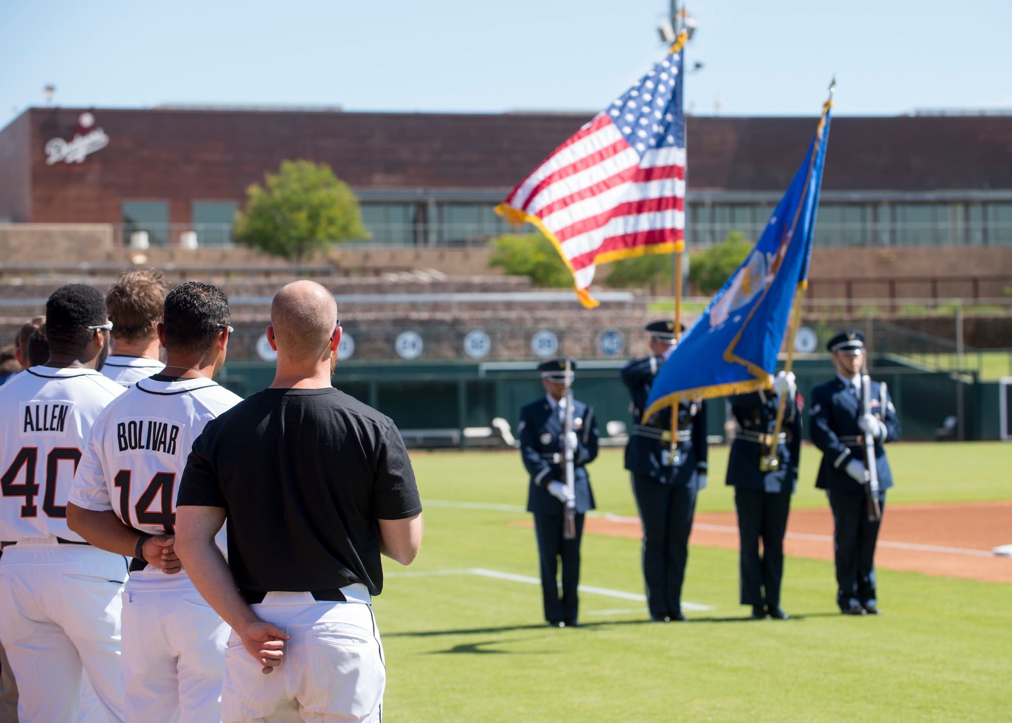 The Glendale Javelinas show respect to the U.S. flag as the Luke Air Force Base Honor Guard post the colors during the National Anthem at a Major League Baseball Arizona Fall League military appreciation game Oct. 6, 2019, at Camelback Ranch stadium in Phoenix.