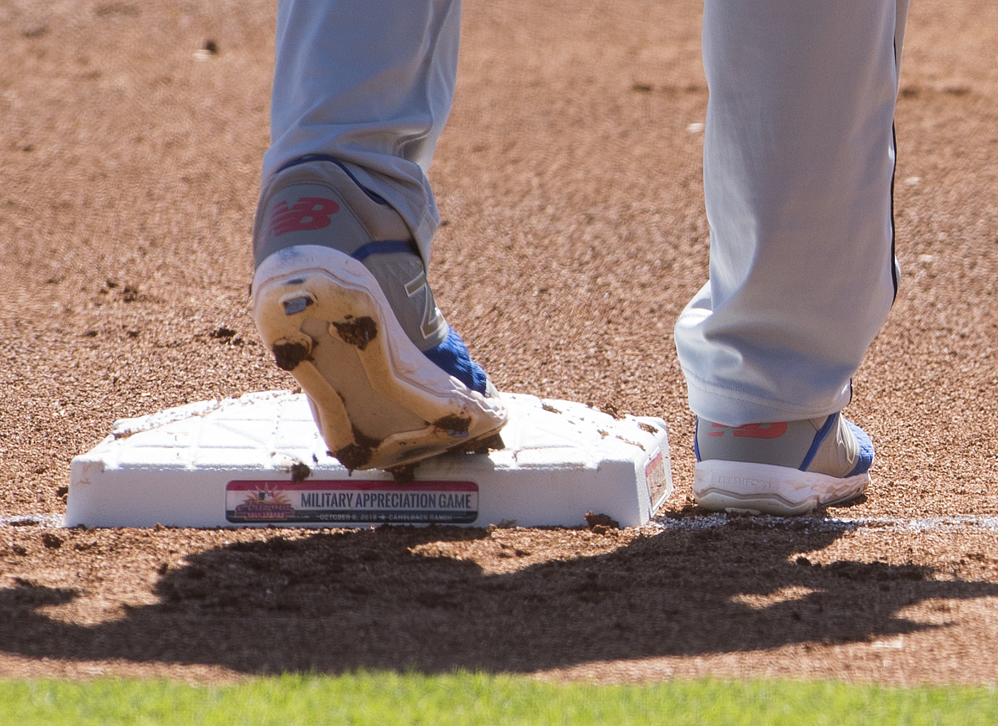 A Scottsdale Scorpion baseball player stands on third base during an Arizona Fall League military appreciation baseball game Oct. 6, 2019, at Camelback Ranch stadium in Phoenix.