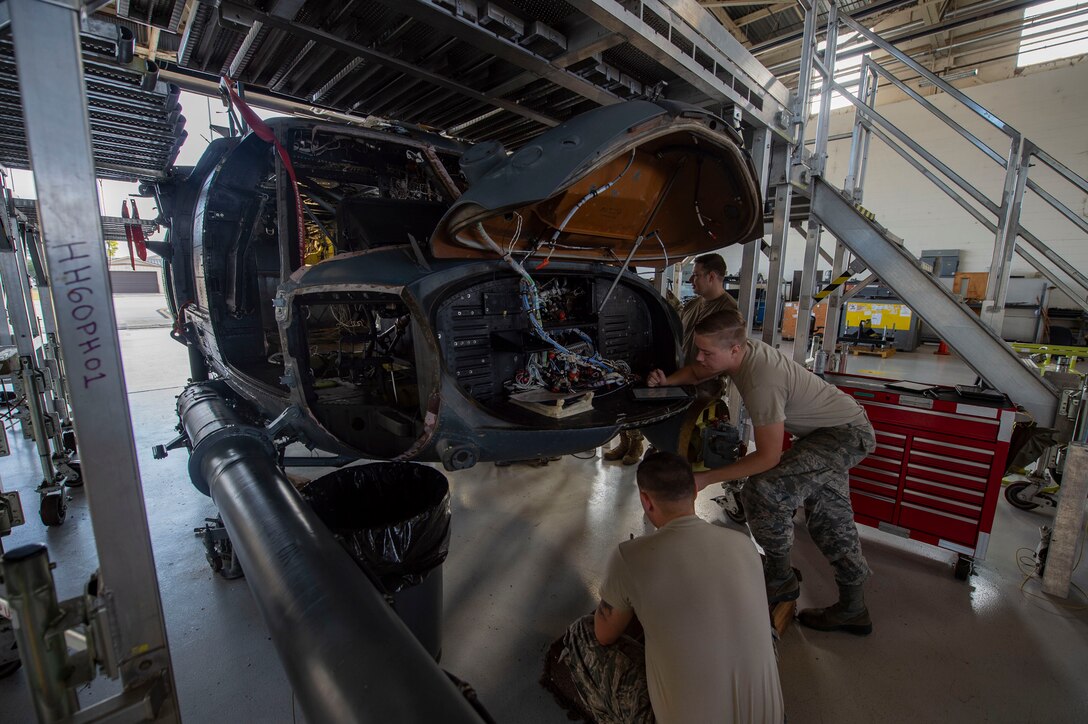 Airmen assigned to the 23d Maintenance Group (MXG) perform an HH-60G Pave Hawk phase inspection Oct. 9, 2019, at Moody Air Force Base, Ga. The 23d MXG maintainers disassemble, inspect and repair the HH-60 after every 600 flight hours. These maintainers continually work to ensure the aircraft are safe and reliable for search and rescue missions. (U.S. Air Force photo by Airman Azaria E. Foster)