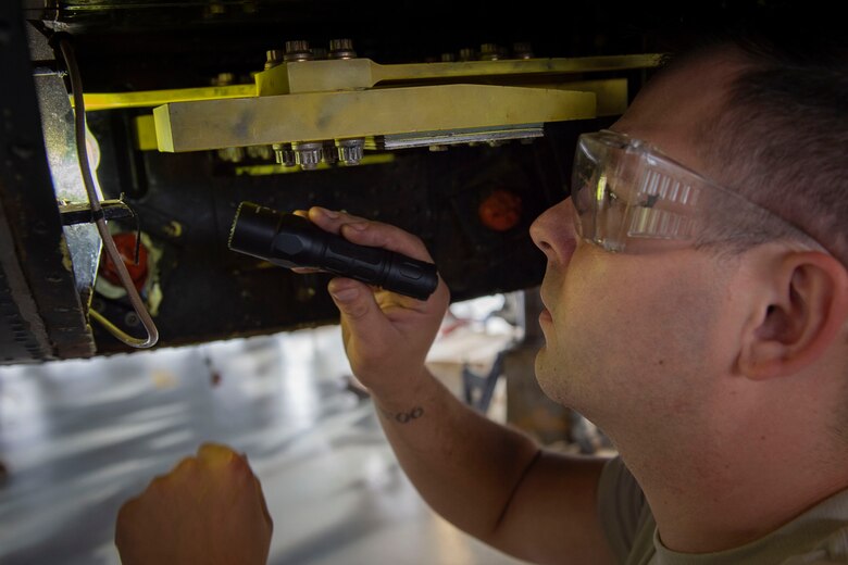 Airman 1st Class Stephen Weidig, 23d Maintenance Squadron (MXS) crew chief, examines a vibration absorber during an HH-60G Pave Hawk phase inspection Oct. 9, 2019, at Moody Air Force Base, Ga. The 23d MXG maintainers disassemble, inspect and repair the HH-60 after every 600 flight hours. These maintainers continually work to ensure the aircraft are safe and reliable for search and rescue missions. (U.S. Air Force photo by Airman Azaria E. Foster)