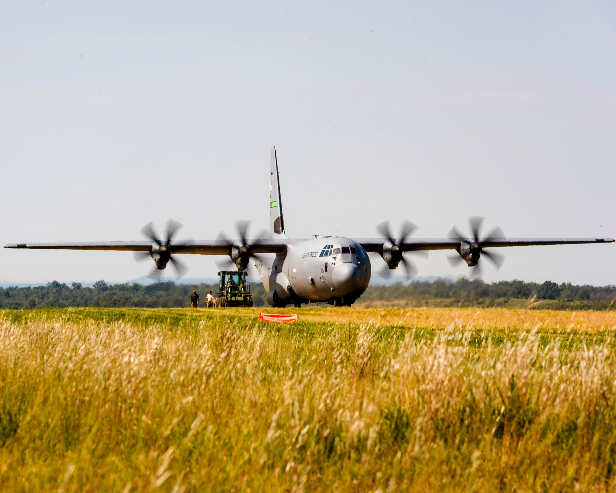 Air Force Reserve aerial transportation specialists approach a C-130J with a forklift to perform a combat offload method-B on a dirt landing zoneon Oct. 5, 2019, located on Fort Chaffee, Ark. Due to evolving combatant command requirements, the Air Force Reserves has increased focus on units operating effectively in degraded environments. (U.S. Air Force Reserve photo by Maj. Ashley Walker)