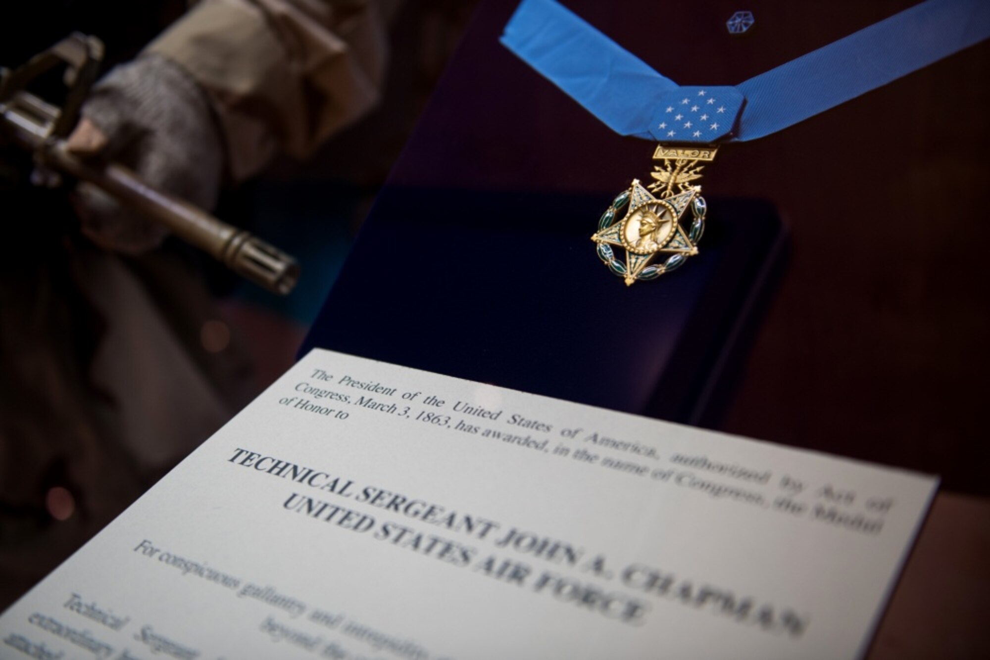 A display of U.S. Air Force Tech. Sgt. John A. Chapman’s Medal of Honor award in the Airman Heritage Museum on Oct. 8, 2019, at Joint Base San Antonio-Lackland, Texas. Chapman distinguished himself as an Air Force Special Tactics Combat Controller, attached to a Navy Sea, Air, and Land (SEAL) Team conducting reconnaissance operations in Takur Ghar, Afghanistan, on Mar. 4, 2002. (U.S. Air Force photo by Sarayuth Pinthong)