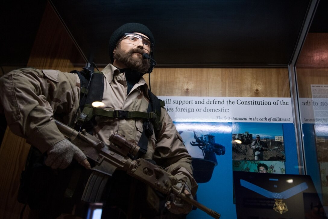 A display of U.S. Air Force Tech. Sgt. John A. Chapman in the Airman Heritage Museum on Oct. 8, 2019, at Joint Base San Antonio-Lackland, Texas. Chapman distinguished himself as an Air Force Special Tactics Combat Controller, attached to a Navy Sea, Air, and Land (SEAL) Team conducting reconnaissance operations in Takur Ghar, Afghanistan, on Mar. 4, 2002. (U.S. Air Force photo by Sarayuth Pinthong)