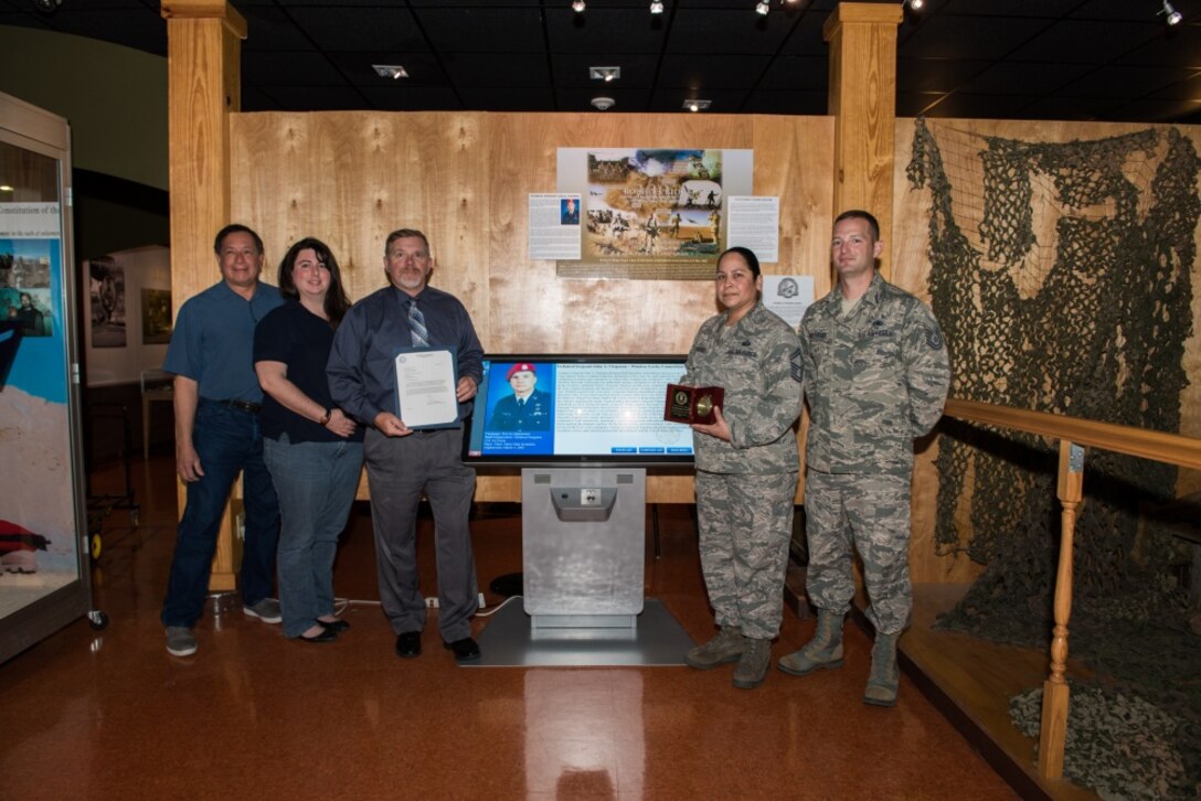 Members of the Airman Heritage Museum's Historian office pose for a picture after receiving the 2019 Air Force Heritage Award in the Enlisted Heritage Training Complex on Oct. 8, 2019, at Joint Base San Antonio-Lackland, Texas. The Airman Heritage Museum collects, researches, preserves, interprets and presents the United States Air Force Enlisted Corps history, heritage, and traditions. The Heritage Award recognizes outstanding accomplishments by Air Force History and Museum members that foster a better understanding and appreciation of the Air Force, its history, heritage and accomplishments. (U.S. Air Force photo by Sarayuth Pinthong)