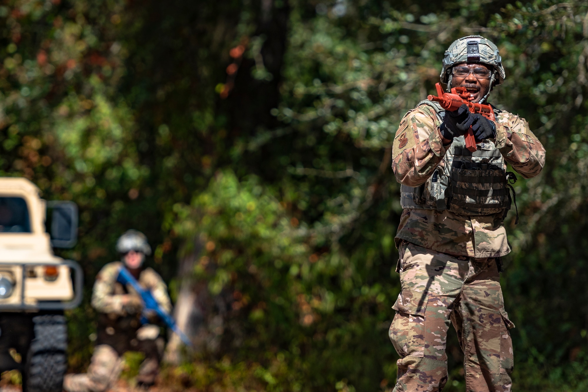 Staff Sgt. Terrance McLaurin, 23d Security Forces Squadron (SFS) installation patrolman, yells during a field convoy operation Oct. 8, 2019, at Moody Air Force Base, Ga. The field convoy operation gave 23d SFS Airmen an opportunity to improve the ability to shoot, move and communicate, ensuring the Airmen are properly trained and prepared to carry out their mission in a contested environment. (U.S. Air Force photo by Airman 1st Class Taryn Butler)