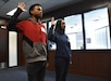 Marquis Butts (left) and his mother, Marva Burns (right), take the oath of enlistment, Oct. 8, Phoenix Military Entrance Processing Station. Both mother and son enlisted simultaneously in the U.S. Army. (U.S. Army Photo by Alun Thomas, Phoenix Recruiting Battalion Public Affairs)