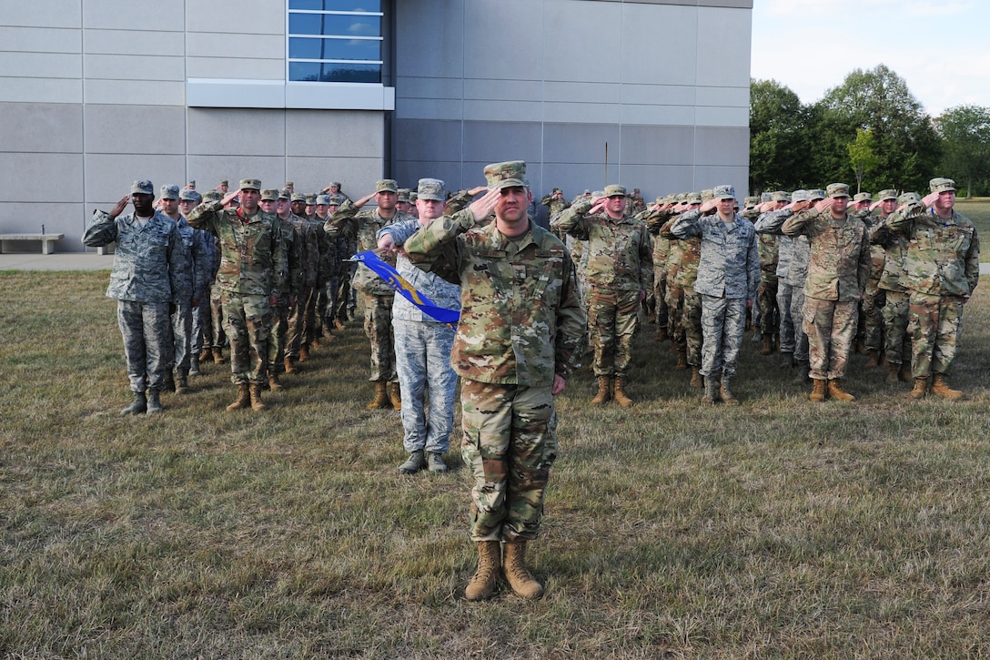 Col. Duane Diesing, commander, Global Exploitation Intelligence Group, leads his group during a Retreat Ceremony on Oct. 1, 2019 at Wright-Patterson Air Force Base, Ohio. A Retreat Ceremony serves a twofold purpose. It signals the end of the official duty day and serves as a ceremony for paying respect to the flag.