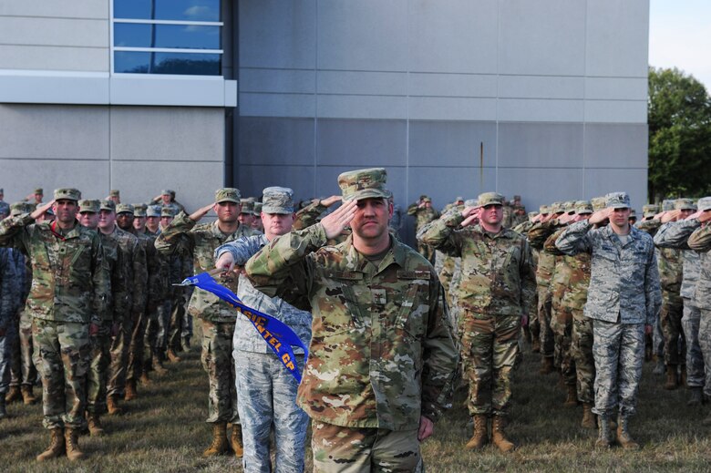 Col. Duane Diesing, commander, Global Exploitation Intelligence Group, leads his group during a Retreat Ceremony on Oct. 1, 2019 at Wright-Patterson Air Force Base, Ohio. A Retreat Ceremony serves a twofold purpose. It signals the end of the official duty day and serves as a ceremony for paying respect to the flag.