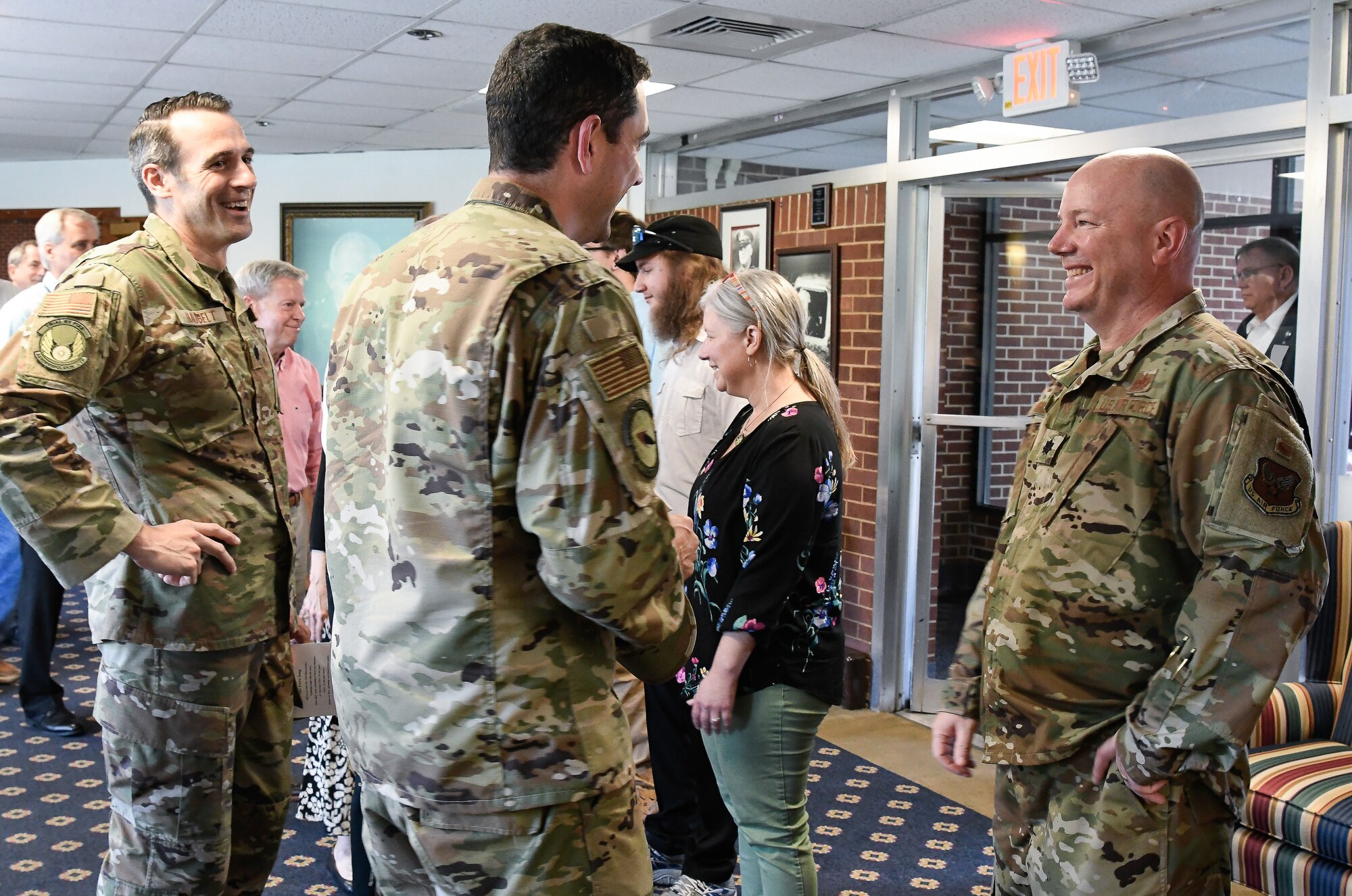 Lt. Col. Jeffrey Burdette, right, new AEDC Test Systems Sustainment Division Chief, speaks with Flight Systems Combined Test Force Director Lt. Col. John McShane, center, and Aeropropulsion CTF Director Lt. Col. Lane Haubelt after the TSS Assumption of Leadership Ceremony Aug. 9 at Arnold Air Force Base. (U.S. Air Force photo by Jill Pickett) (This image has been altered by obscuring a badge for security purposes.)