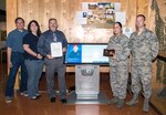 Members of the Airman Heritage Museum's Historian office pose for a picture after receiving the 2019 Air Force Heritage Award in the Enlisted Heritage Training Complex Oct. 8 at Joint Base San Antonio-Lackland. The Airman Heritage Museum collects, researches, preserves, interprets and presents the United States Air Force Enlisted Corps history, heritage, and traditions. The Heritage Award recognizes outstanding accomplishments by Air Force History and Museum members that foster a better understanding and appreciation of the Air Force, its history, heritage and accomplishments.