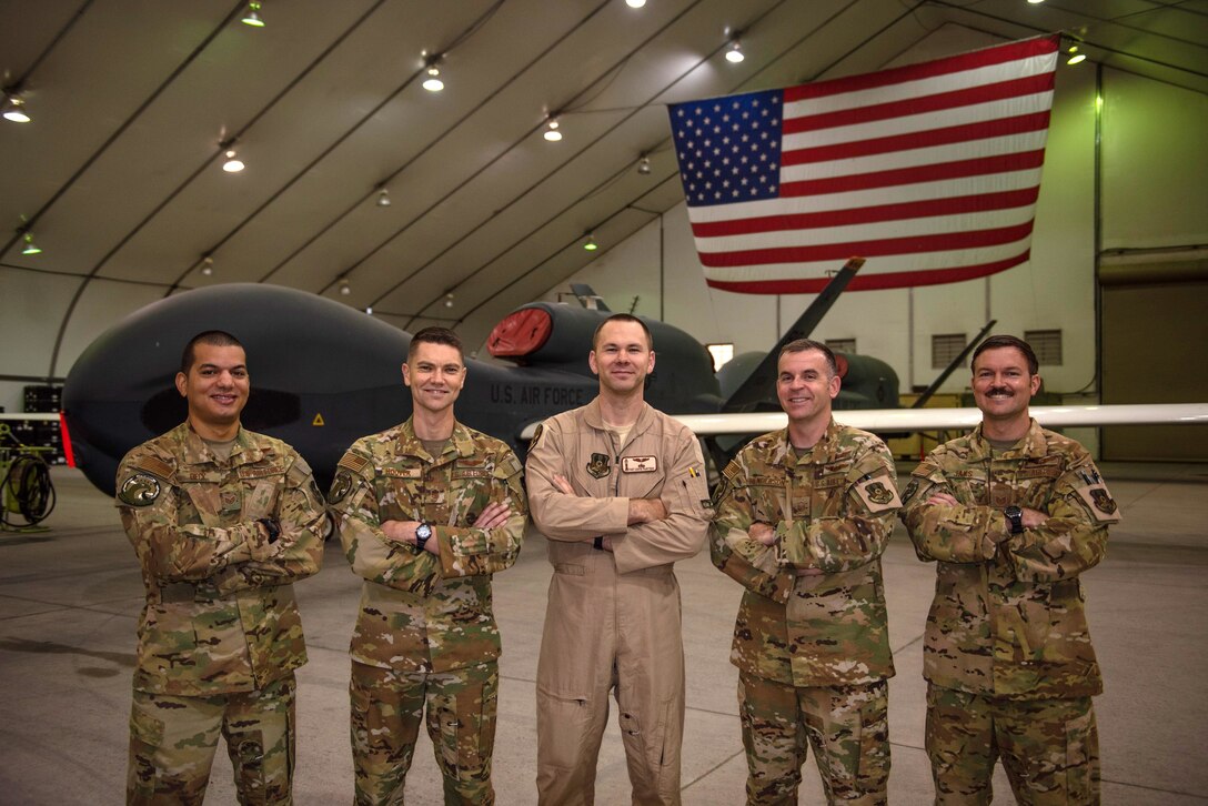 Enlisted RQ-4 Global Hawk crew members pose for a photo Oct. 10, 2019, at Al Dhafra Air Base, United Arab Emirates. For the first time downrange, an all-enlisted crew launched and recovered an RQ-4s to perform operations out of Al Dhafra Air Base, United Arab Emirates, Sept. 13, 2019. (U.S. Air Force photo by Staff Sgt. Chris Thornbury)