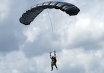 Service member jumping out of an airplane using the RA-1 parachute.