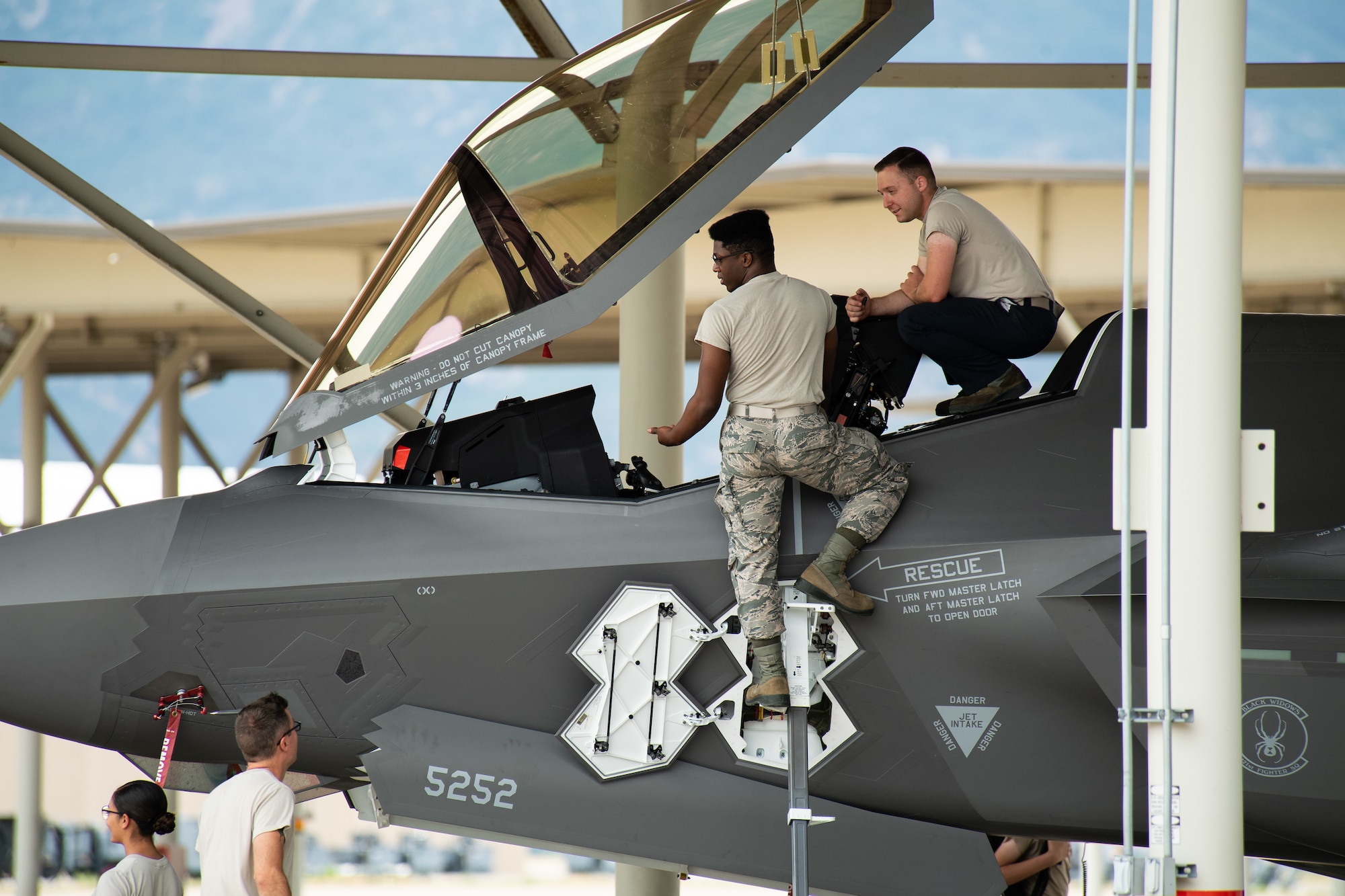 Crew Chiefs with the 421st Aircraft Maintenance Unit work on an F35A Lightning II returning to Hill Air Force Base, Utah, July 31, 2019, after a two-month European deployment. The 421st Fighter Squadron participated in several combat exercises with allied and partner nations while deployed. (U.S. Air Force photo by R. Nial Bradshaw)