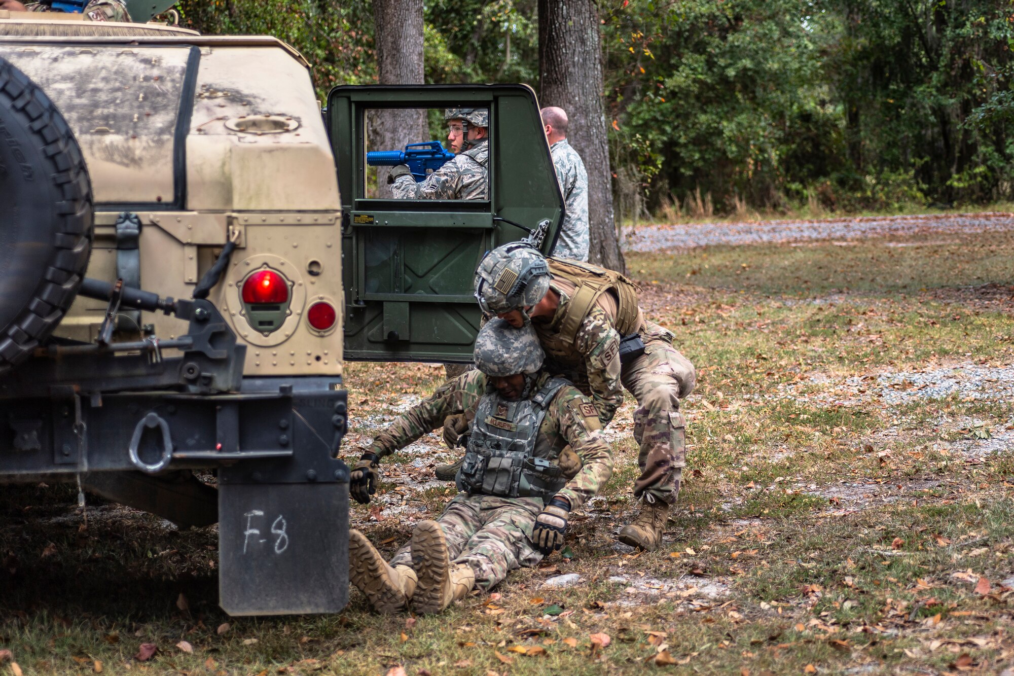 Senior Airman Daniel Boone, 23d Security Forces Squadron (SFS) installation patrolman, carries a simulated casualty during a field convoy operation Oct. 8, 2019, at Moody Air Force Base, Ga. The field convoy operation gave 23d SFS Airmen an opportunity to improve the ability to shoot, move and communicate, ensuring the Airmen are properly trained and prepared to carry out their mission in a contested environment. (U.S. Air Force photo by Airman 1st Class Taryn Butler)