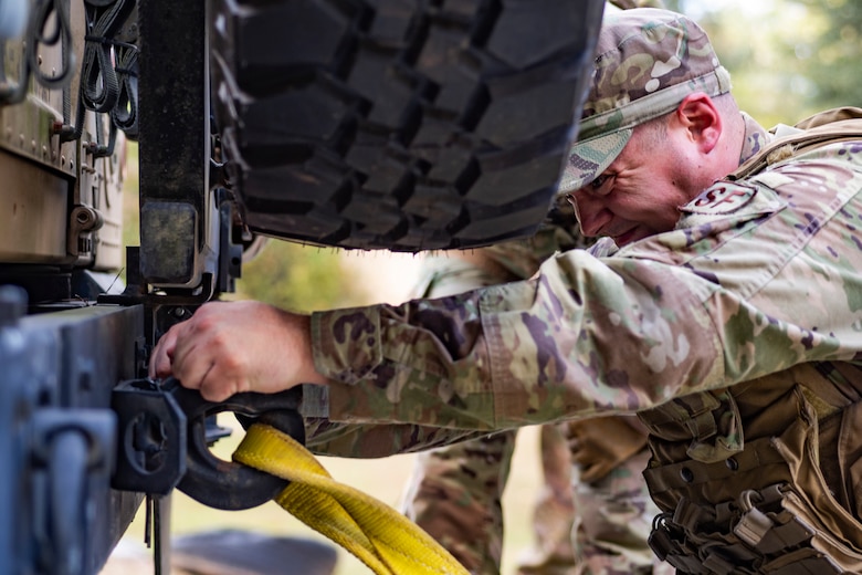 An Airman with the 23d Security Forces Squadron (SFS) unhooks a towing strap during a field convoy operation Oct. 8, 2019, at Moody Air Force Base, Ga. The field convoy operation gave 23d SFS Airmen an opportunity to improve the ability to shoot, move and communicate, ensuring the Airmen are properly trained and prepared to carry out their mission in a contested environment. (U.S. Air Force photo by Airman 1st Class Taryn Butler)