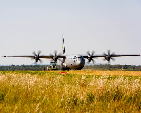 Air Force Reserve aerial transportation specialists approach a C-130J with a forklift to perform a combat offload method-B on a dirt landing zoneon Oct. 5, 2019, located on Fort Chaffee, Ark. Due to evolving combatant command requirements, the Air Force Reserves has increased focus on units operating effectively in degraded environments. (U.S. Air Force Reserve photo by Maj. Ashley Walker)