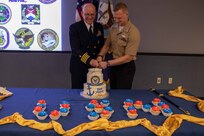 As the oldest and youngest members, Joint Task Force Civil Support Command Surgeon U.S. Navy Capt. Bryan Schumacher (left) and U.S. Navy Hospital Corpsman 3rd Class Tyler Arentzen (right) cut the cake during the 244th Navy birthday celebration. The cake-cutting ceremony signifies an annual renewal of each Sailor’s commitment to the Navy, and the Navy’s commitment to our nation. The tradition of the youngest and oldest Sailors cutting the cake signifies the passing of knowledge and experience from senior to junior Sailors. The theme of this year’s celebration, “No Higher Honor,” originates from a quote by Lt. Cmdr. Robert Copeland, commanding officer of the World War II destroyer USS Samuel B. Roberts (DDE-413). (Official DoD photo by Mass Communication Specialist 3rd Class Michael Redd/RELEASED)