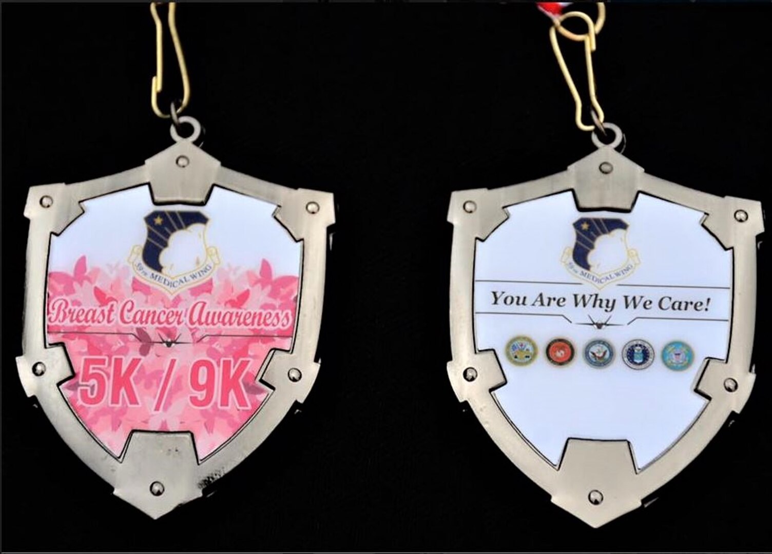 These are medals for participants of the 59th Medical Wing  annual Breast Cancer Awareness 5K/9K at 9 a.m. Oct. 26 at Joint Base San Antonio-Randolph’s Heritage Park.The annual event, which is open to anyone with base access, raises awareness of breast cancer and the importance of early detection and regular screenings during Breast Cancer Awareness Month.